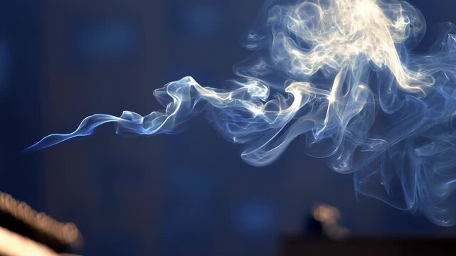 Smoke trails form with varying motion densities concept. Abstract white smoke swirling on dark blue background with soft glowing light and delicate curls
