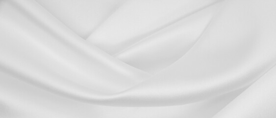 Obraz premium Smooth elegant white silk or satin luxury cloth texture as wedding background. Luxurious background design