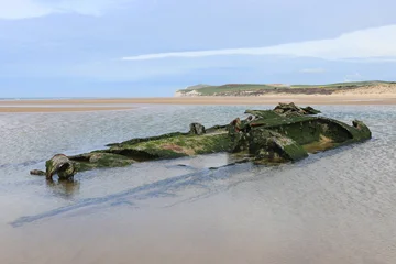 Fototapete Schiffbruch The ship wreck remains of the German World War One U-boat Submarine UC-61, stranded on the beach at Wissant, on the Opal Coast of Northern France.  © Imladris