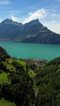 Lake Lucerne the Four Forested Settlements village Morschach in Central Switzerland aerial drone