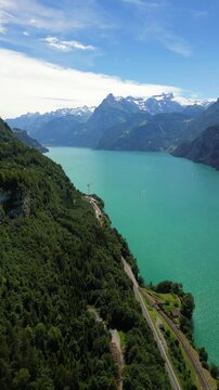 lake Lucerne dramatic cliffs and snow-capped peaks of the European Alps Switzerland aerial drone