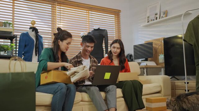 Entrepreneurs managing their online clothing business from home