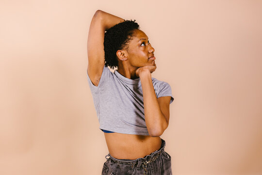 Female black dancer in pose with arms and head looking to side