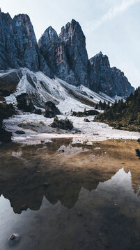 lake in the dolomites mountains under the heights of odle group
