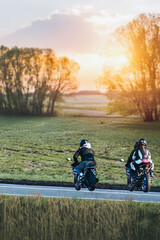 Obraz premium Driver gripping handlebar on open country road
