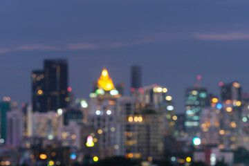 Abstract blurred background cityscape of Krung Thep Maha Nakhon (Bangkok) on night scene with multicolour bokeh from neon light on building