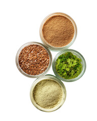 Four jars of dry culinary ingredients form a clover on black