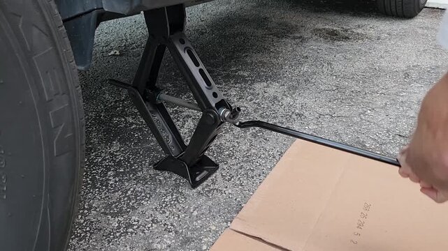 Manual Screw Jack Expanding Under Car During Lift