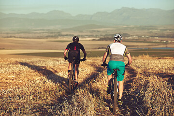 Obraz premium People, cycling and mountain bike outdoor for adventure, race preparation and endurance training. Back, friends and journey on countryside trail with bicycle, sports workout and exercise for fitness.