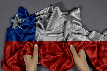 Hands Holding Draped Chilean Flag Silk Fabric With Red, White, And Blue Colors, Artistic Texture