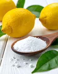 Bright yellow citrus fruit with a scoop of white powder on a wooden spoon