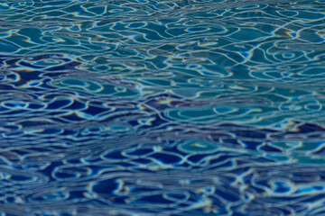 The water is blue and has ripples