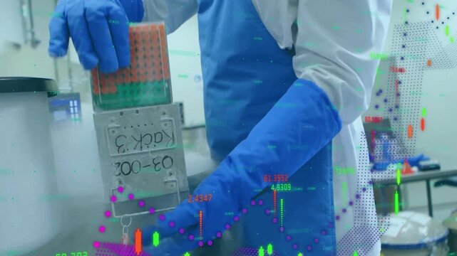 Male lab technician placing hand on dewar lid, lifting it, inspecting and handing tray to colleague