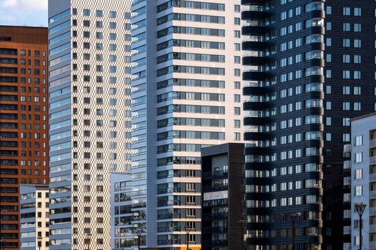 Clean modern architecture building showing residential apartment highrise facade with balcony and windows in Liljeholmskajen district of Stockholm Sweden