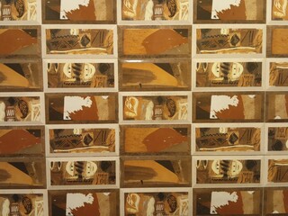 Abstract Ceramic Wall Tile Pattern with Earthy Tones - Decorative Interior Surface Featuring Brown, Ochre, and White Artistic Graphic Motifs