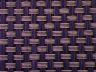 Macro Texture of Purple and Tan Synthetic Weave - Detailed Interlaced Pattern of Plastic Rattan Material for Furniture and Place Mats