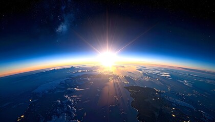 Planet Earth from space, sunbursting, atmospheric glow and starry backdrop