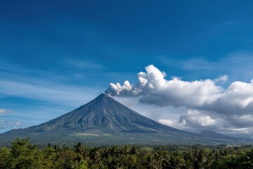 Fototapeta premium Majestic mayon volcano eruption under blue sky in the philippines