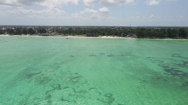Aerial view flying over tropical paje beach in zanzibar