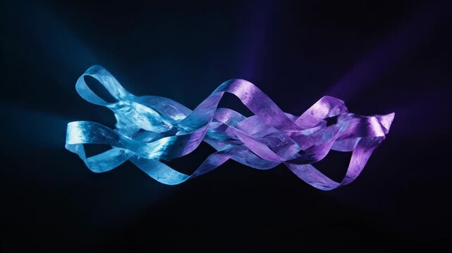 Festive blue and purple ribbons dancing in the air, abstract festive footage video, luxury gift wrapping, dark background, close-up view