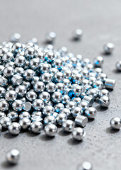 Metallic Silver Balls and Cylinders on Gray Background for Industrial Use and Design