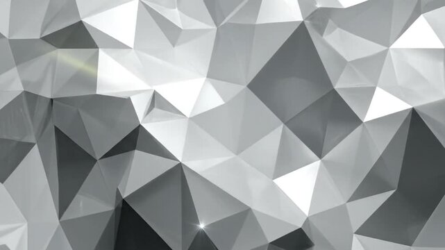 Abstract geometric background with triangular shapes in shades of gray and white.