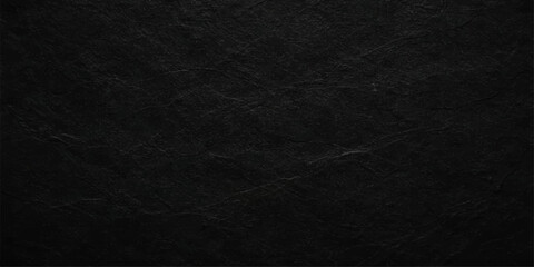 Fototapeta premium A dark, rough black paper texture with a grunge material surface creates a blank, old macro pattern suitable for a gray textile or leather backdrop wallpaper design