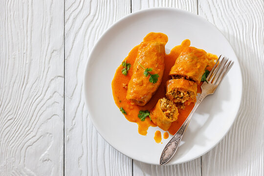Stuffed cabbage rolls with quinoa and tomato sauce