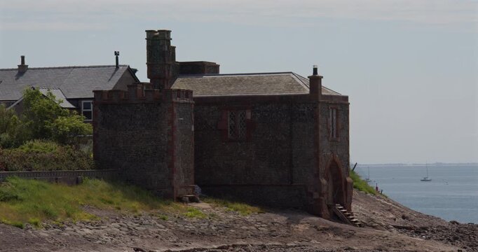 Wide shot of the Watch Tower at low tide on roa island, near barrow in furness,