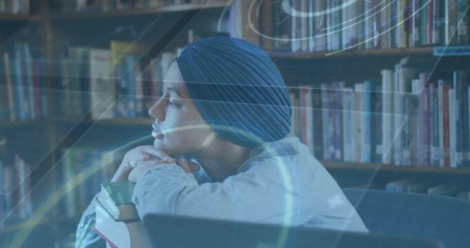 Student resting chin on hands while glancing left and activating holographic overlay guiding study
