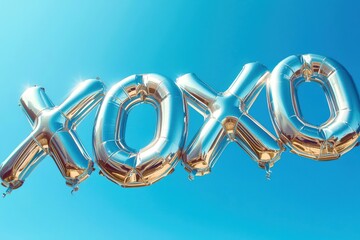 A large silver balloon with the letters XOXO on it