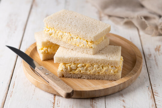 Tamago Sando sandwich on white wooden table