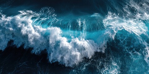 Detailed aerial view of a large, crashing ocean wave with white foam