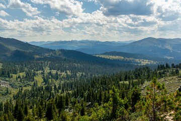Mountain landscape. Beautiful view of the mountains covered with coniferous forest. Ergaki Nature Park. © Province_photo