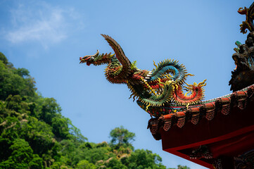 A traditional Chinese dragon adorns the roof of Futian Temple on Lion&rsquo;s Head Mountain, symbolizing power, protection, and prosperity within Taiwanese religious architecture.

