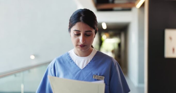 Nurse, documents and reading with woman in hospital for treatment plan, patient history or medical report. Healthcare diagnosis, insurance paperwork or checkup records with person for doctor referral