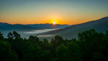 Sunrise over a serene mountain landscape with trees