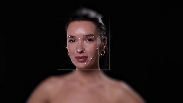 Video ad. Female face with biometric facial mapping on black background. Concept of facial recognition technology, digital identity, biometric security, data analysis and future verification systems.
