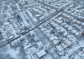 Aerial photo of a snowy area with residential buldings in the city of Kornwestheim in Baden-Wuerttemberg, Germany
