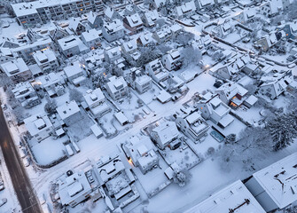 Aerial photo of a snowy area with residential buldings in the city of Kornwestheim in Baden-Wuerttemberg, Germany
