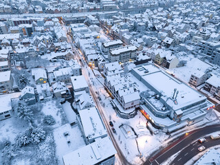 Aerial photo of a snowy area with residential buldings, shpping center and administrative buildings in the city of Kornwestheim in Baden-Wuerttemberg, Germany

