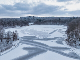 Winter landscape of the frozen lake in Poland.