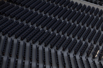 Fototapeta premium Abstract pattern of empty dark stadium seats