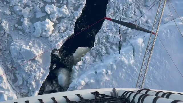 Expedition Ship Navigating Through Dense Antarctic Sea Ice