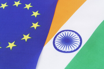 European Union and Indian flags close-up. Relationship of EU and India.