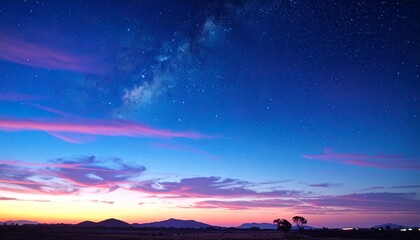 Obraz premium Vibrant Sunset Sky with Milky Way Galaxy Over Scenic Landscape Horizon