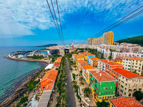 Aerial View of Mediterranean Style Colorful Buildings, Palm Lined Streets, and Modern Architecture at Sunset Town in Phu Quoc