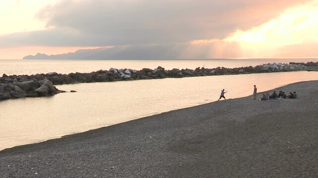 A beach at sunset in Chiavari