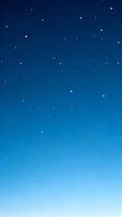 Obraz premium A serene night sky gradient transitioning from deep blue to light blue dotted with twinkling stars of varying sizes.