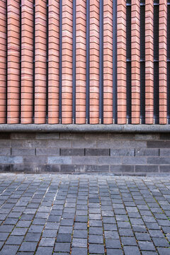 Minimal urban cobblestone pavement texture with tiles wall pattern in daylight showing an empty surface background for design with copy space